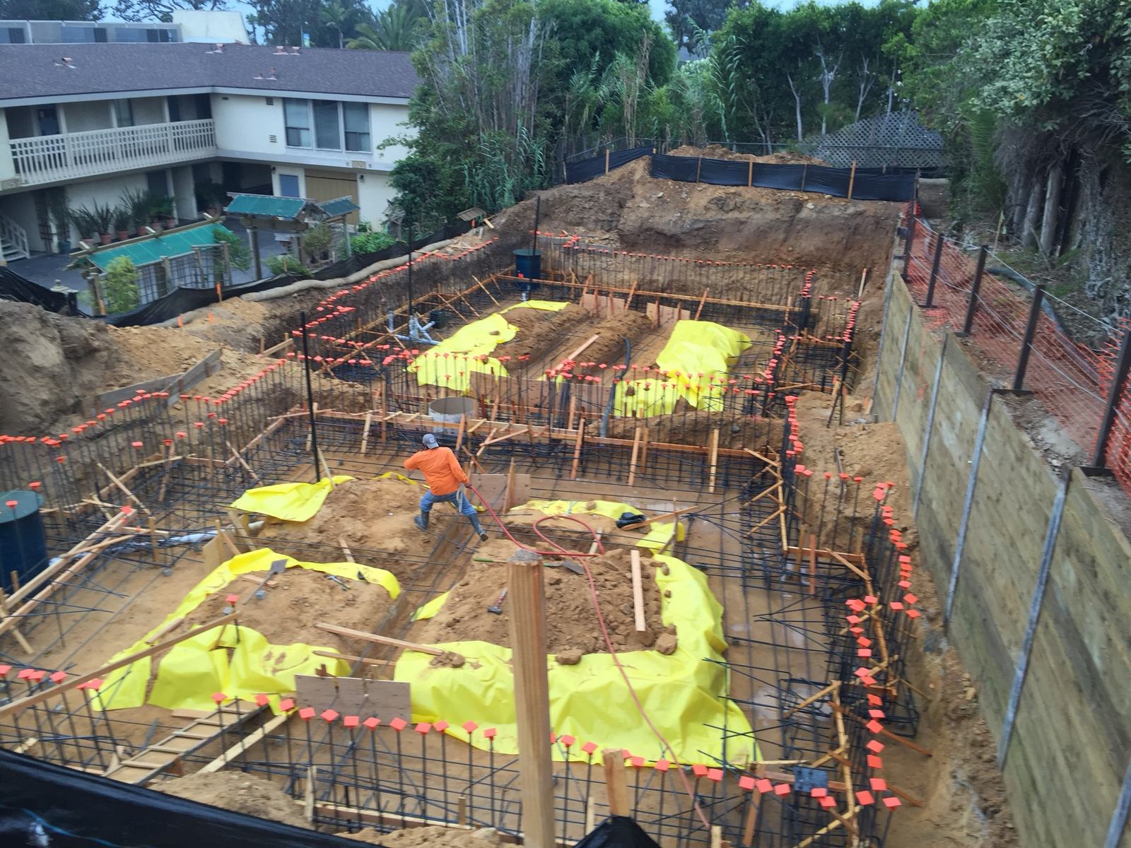Full foundation reinforcing mat and vapor barrier ready for inspection