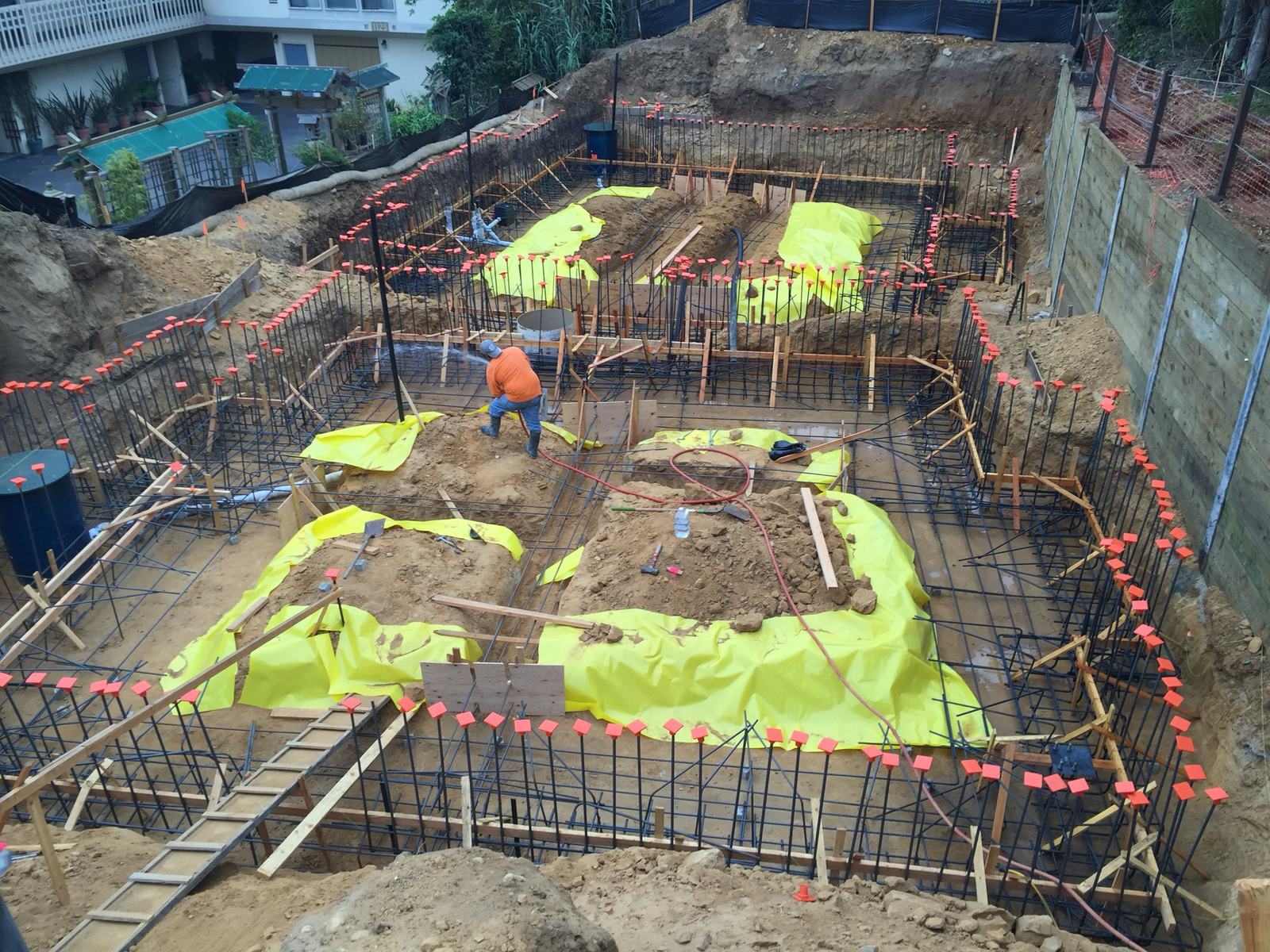Foundation rebar and vapor barrier across the basement footprint