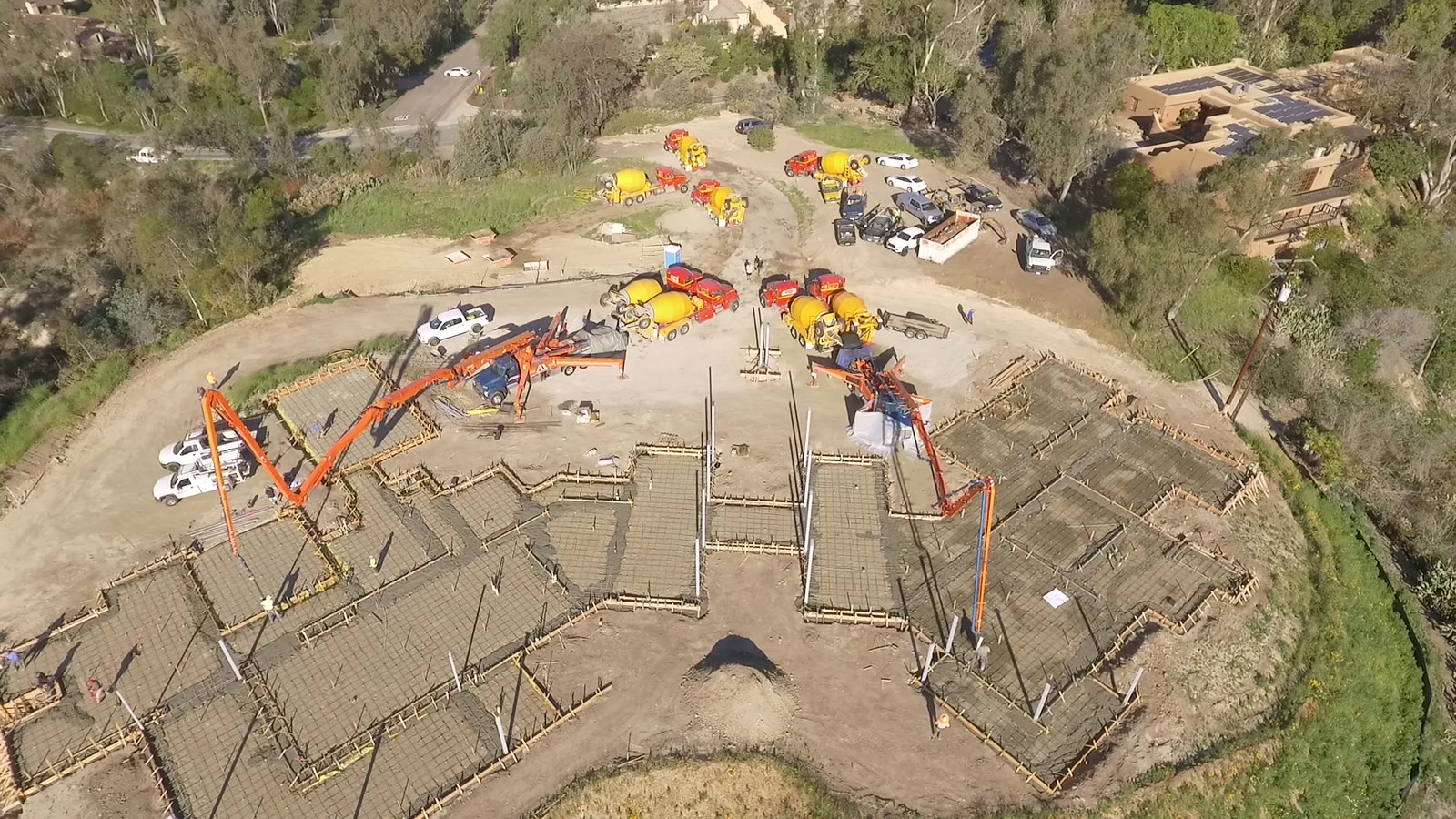Drone aerial of a 4x8 foundation pour at the Linea Del Cielo estate, Rancho Santa Fe