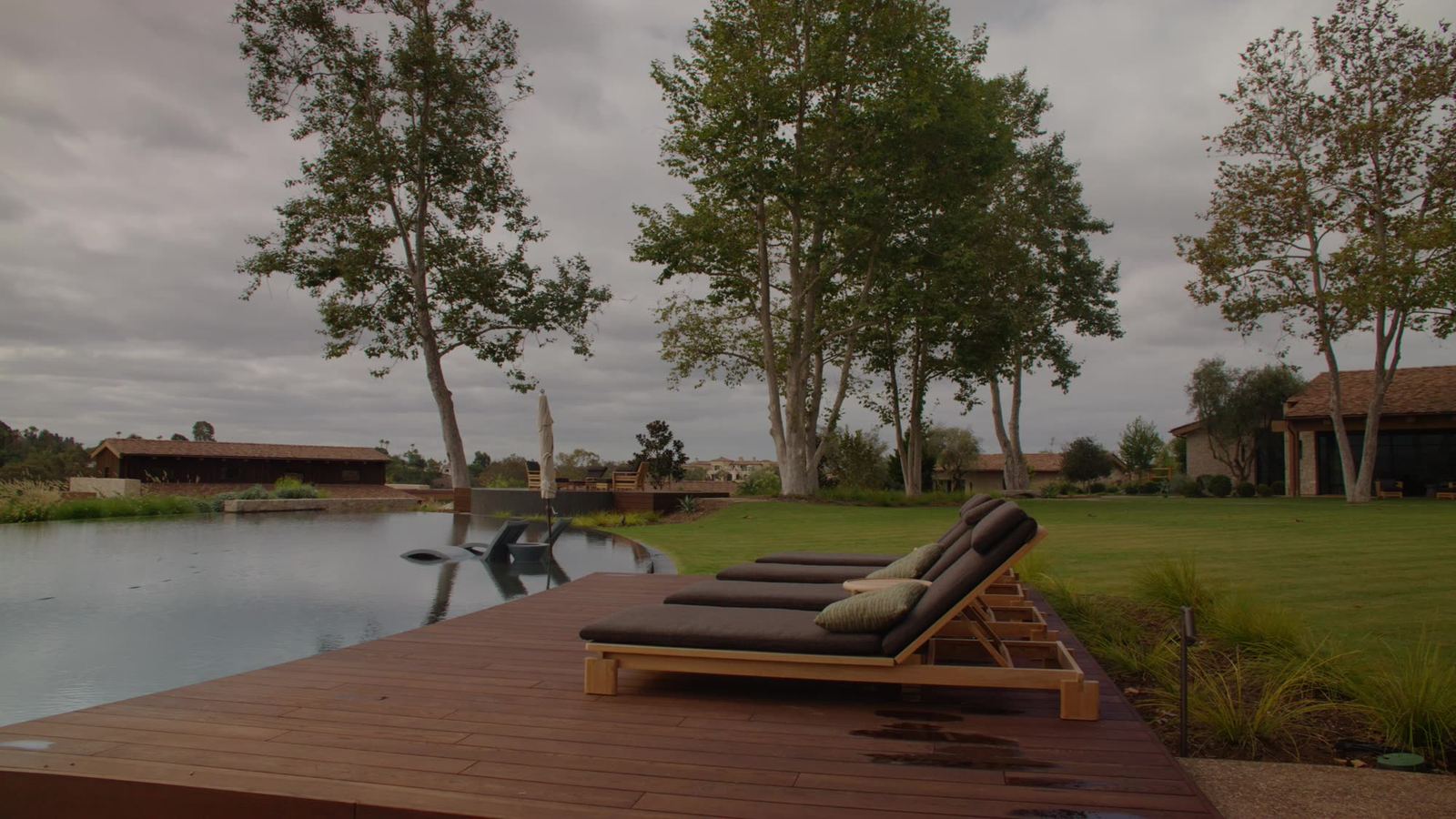 Pool deck and wood decking overlooking the pond