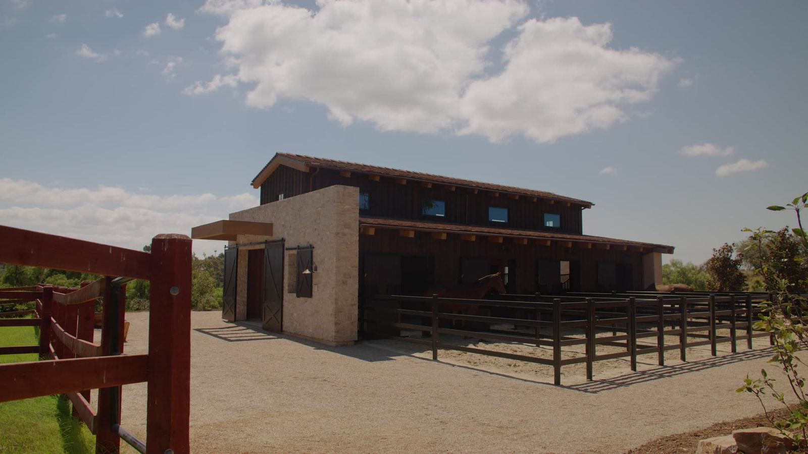 Barn and corral with gravel drive at North Montevideo
