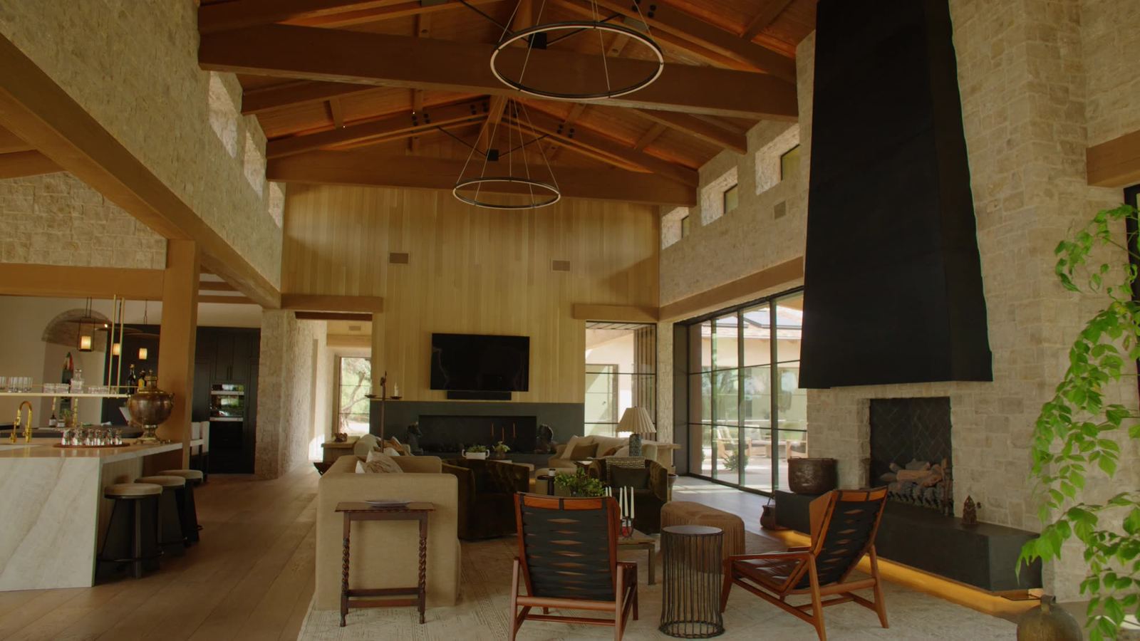 Great room under a vaulted exposed-beam ceiling