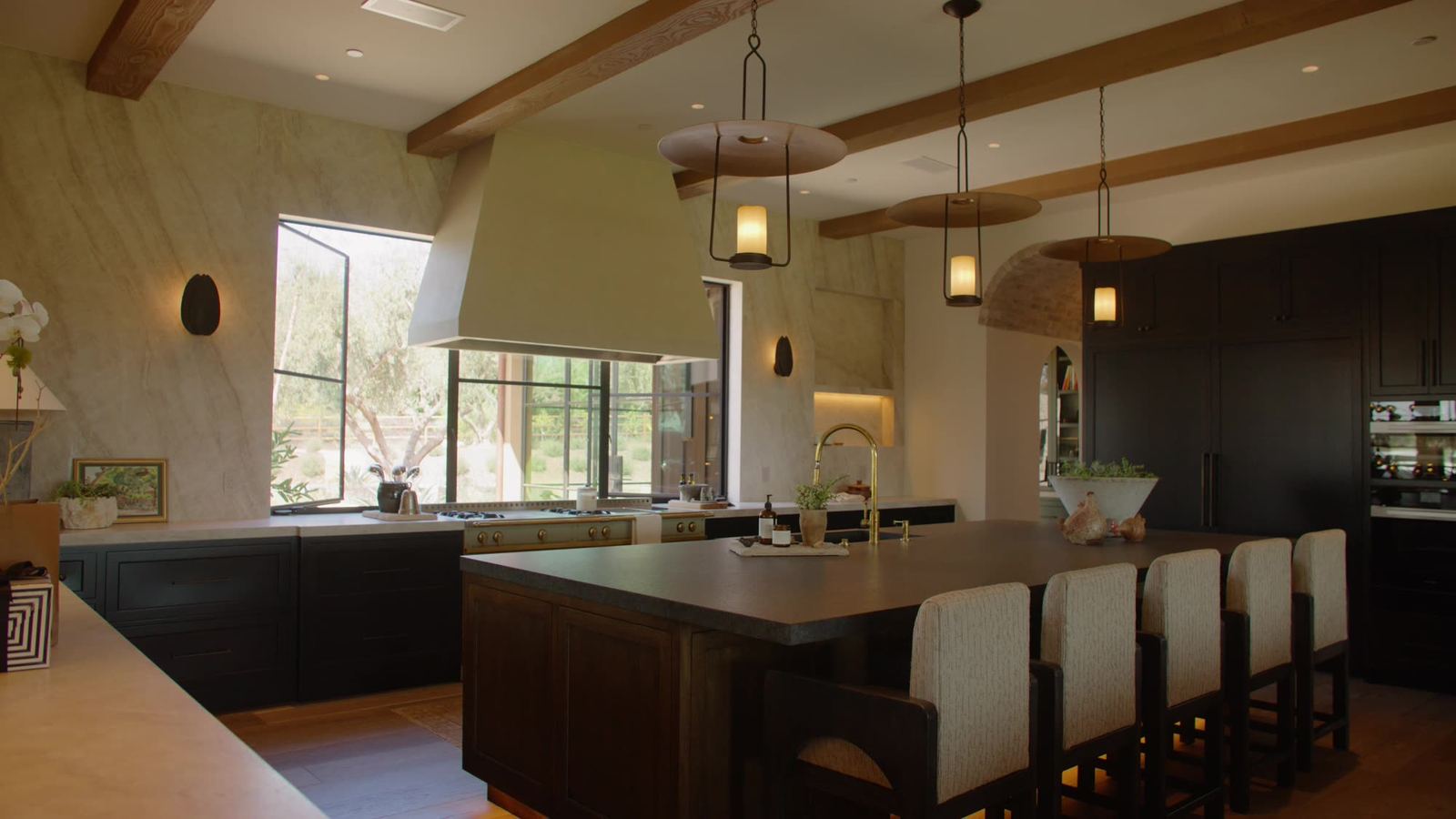 Kitchen with exposed beams and timber ceiling