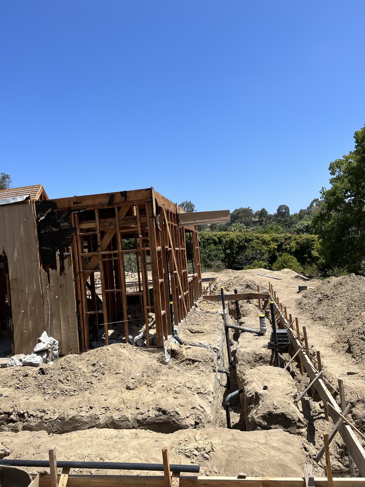 Formed footings alongside the framed structure
