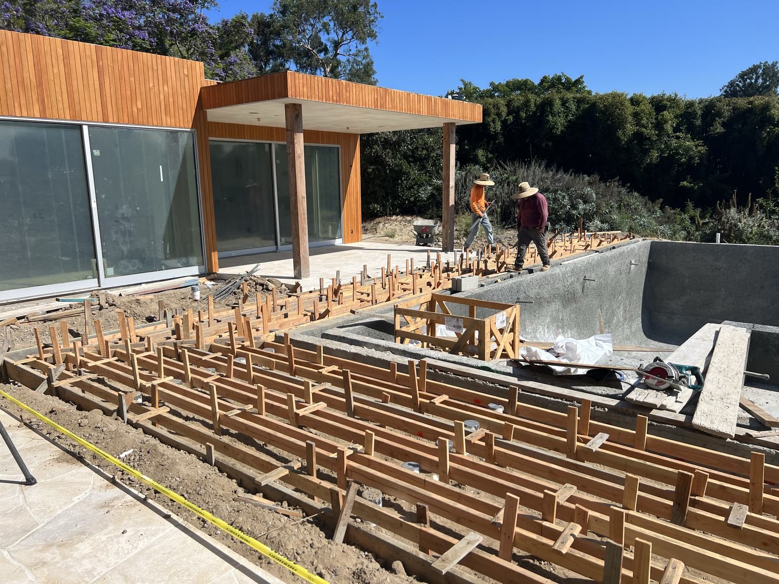 4x8 crew forming radiating concrete stem walls for the teak deck