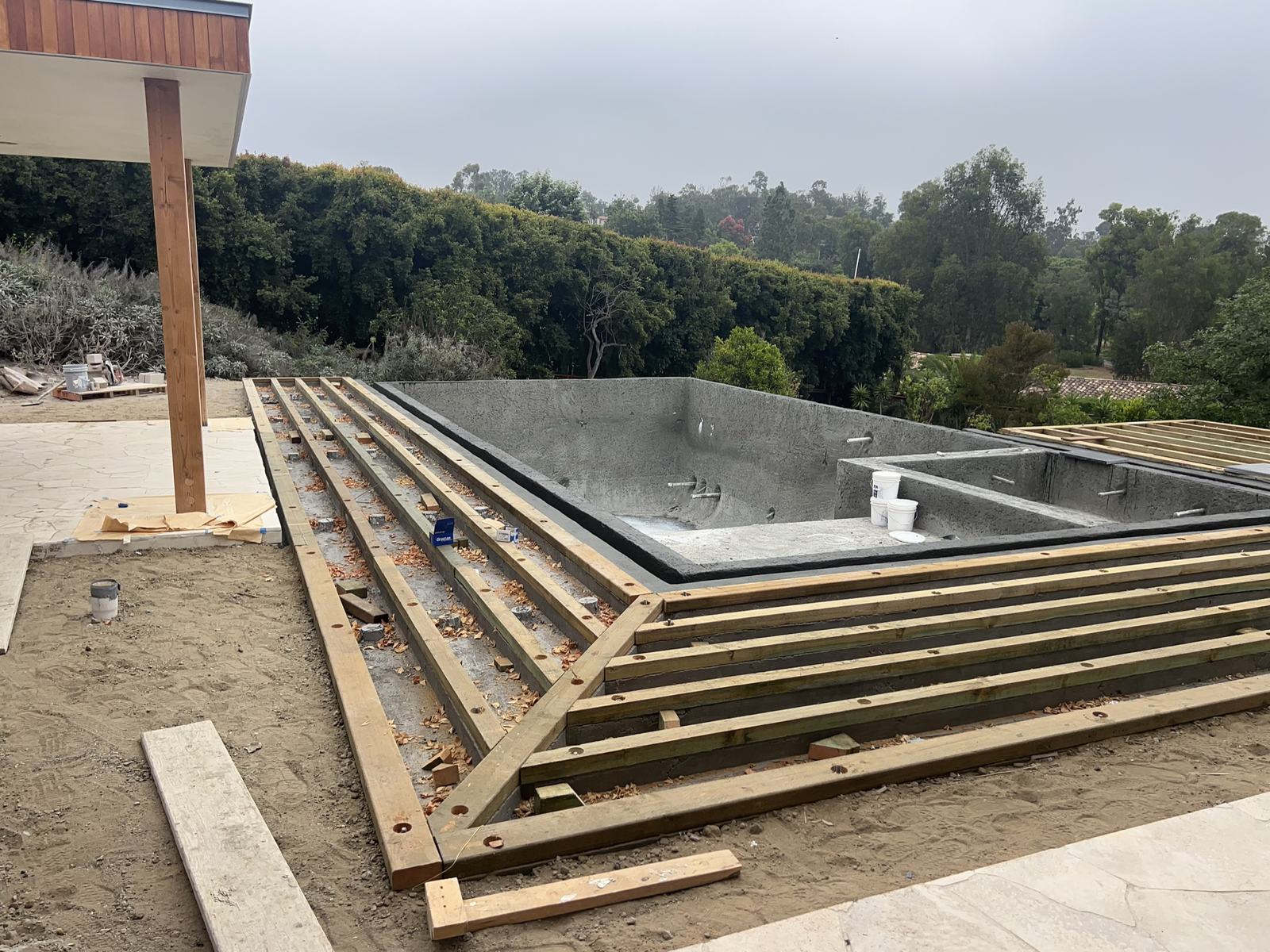 Teak deck sleepers set across the concrete stem walls