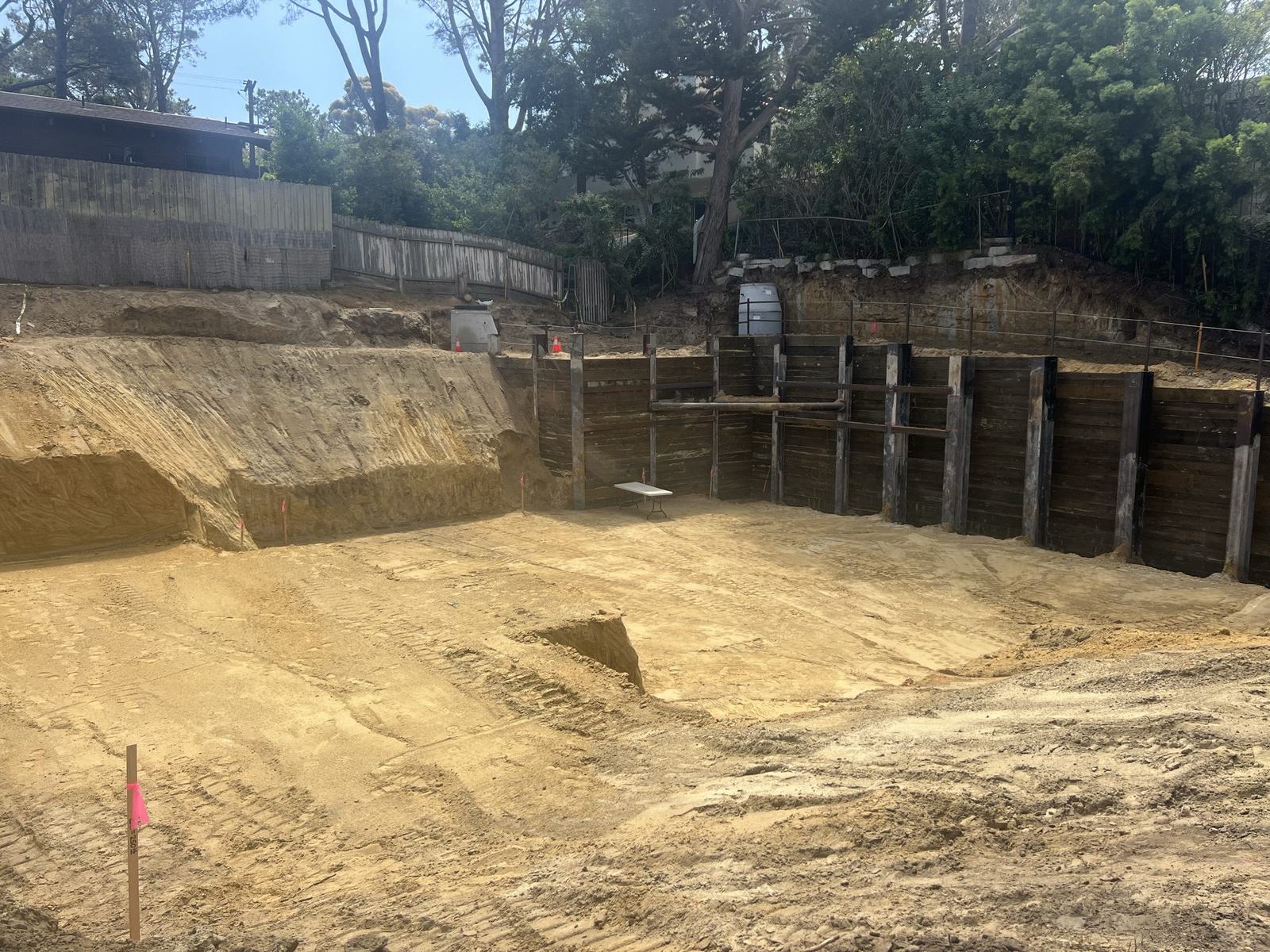 Deep shored basement excavation cut into a Del Mar hillside
