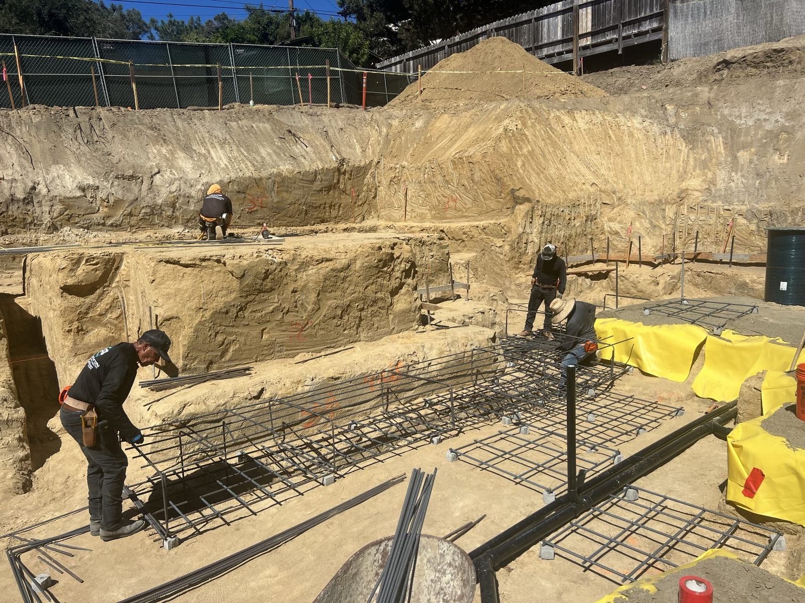 4x8 crew tying reinforcing steel for spread footings