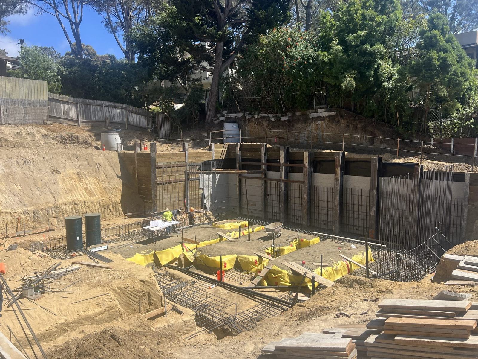 Formed footings and reinforcing inside the shored excavation