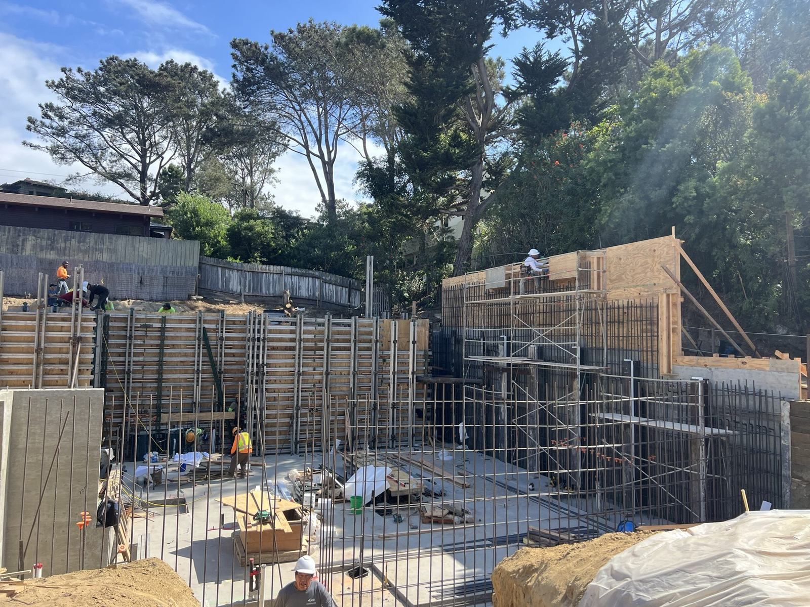 Cast-in-place basement wall forms going up across the excavation