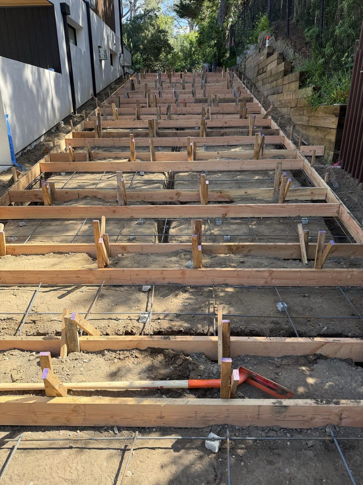 Stepped walkway forms running the length of the side yard