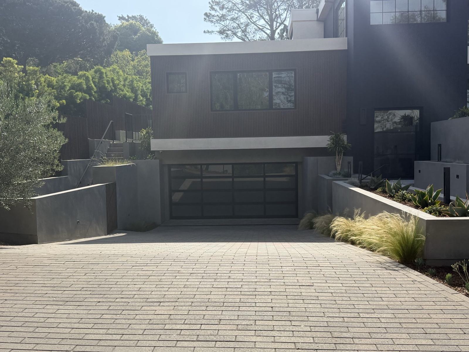 Finished paver motor court and board-formed concrete planters