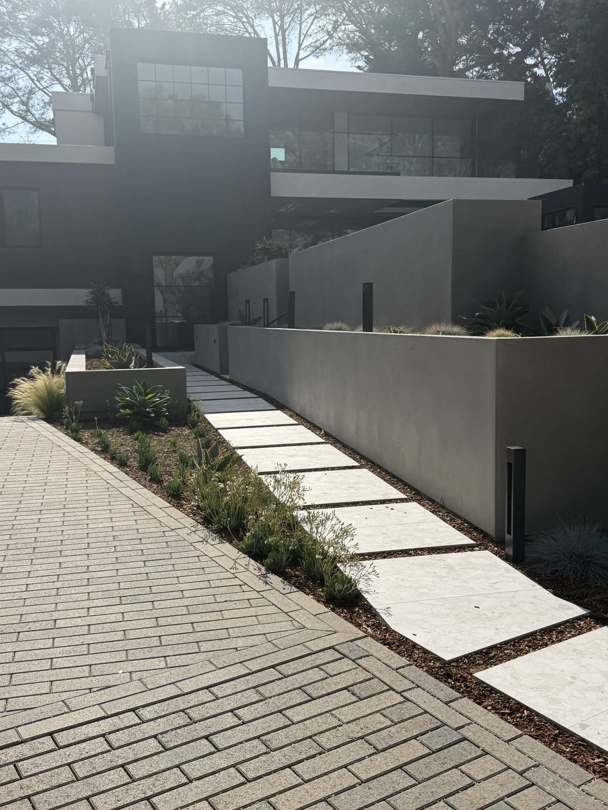 Entry walkway and privacy walls at dusk, Del Mar